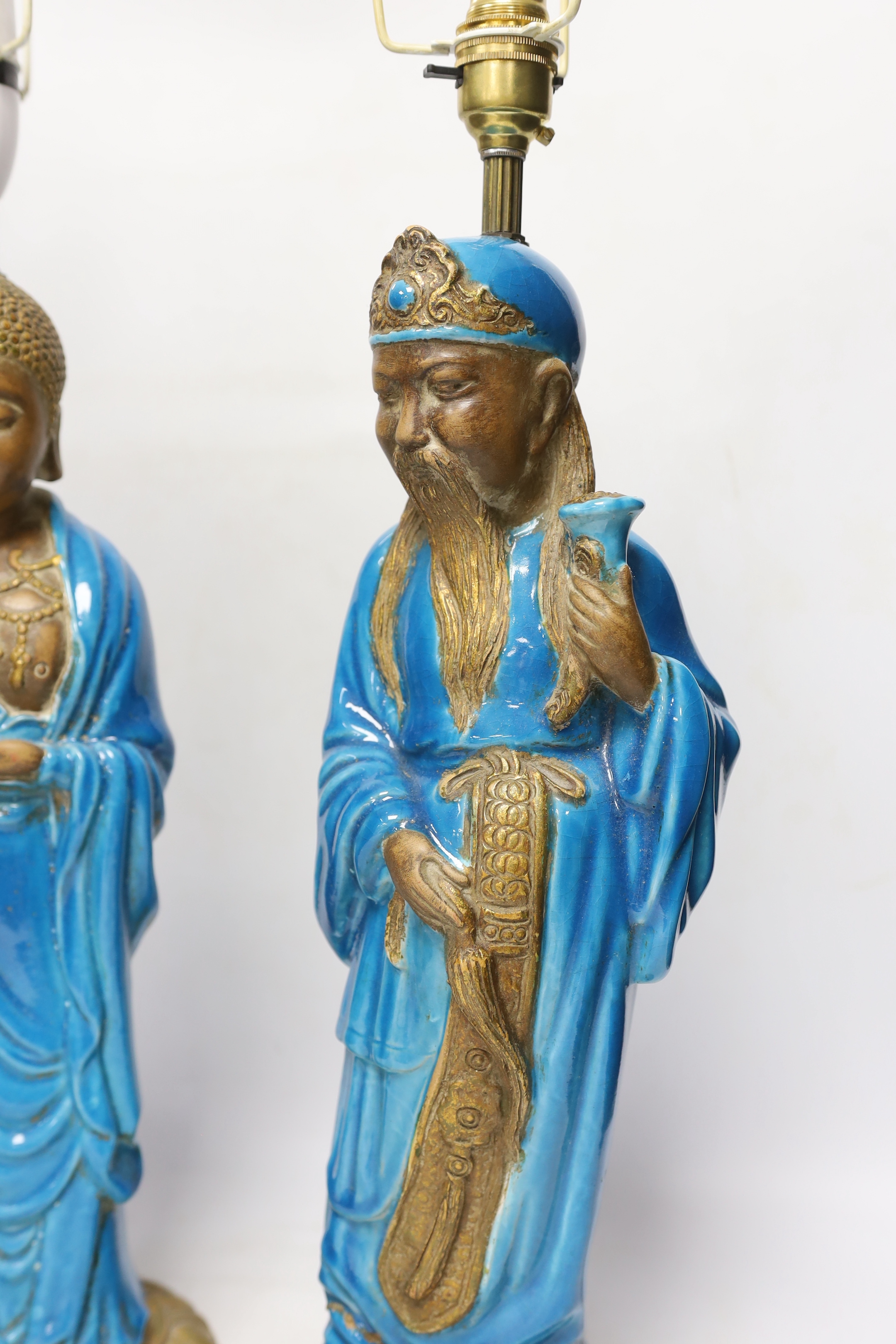 Two Chinese decoratively glazed and gilded pottery figures converted to lamp bases, approximately 44cm high